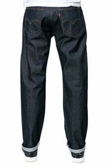 Back view of dark blue jeans with rolled cuffs.