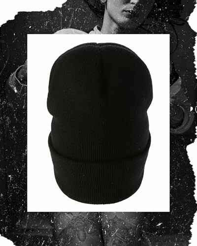 The black beanie hat on a textured background, showcasing the quality of the materials and craftsmanship.