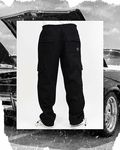 Black cargo pants with pockets, worn with white sneakers, car in background.