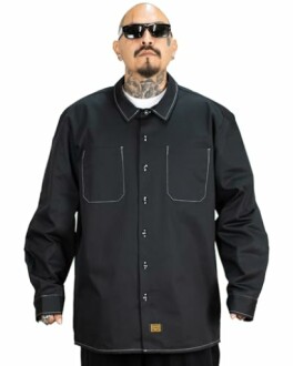 Person wearing a black button-up shirt and sunglasses with tattoos visible.