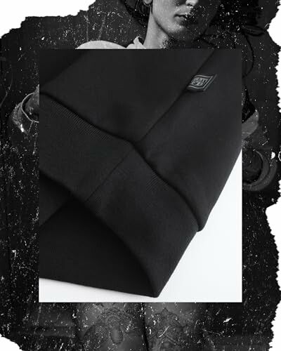 Black sweatshirt with logo on artistic background