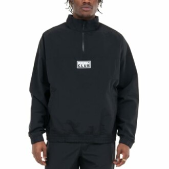 Person wearing a black zip-up jacket with club logo