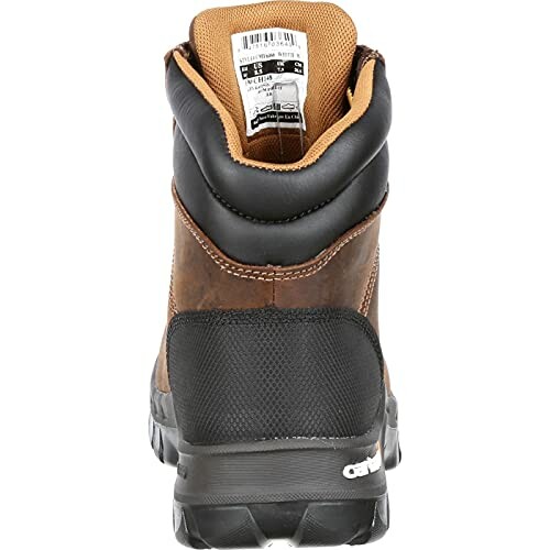 Back view of a brown leather work boot with label.
