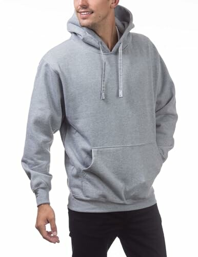 Person wearing a gray hoodie, smiling