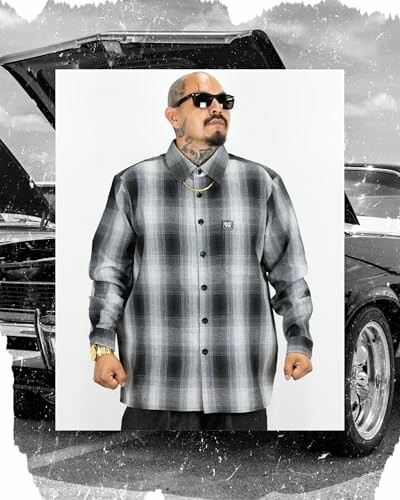 Man in plaid shirt standing in front of a car