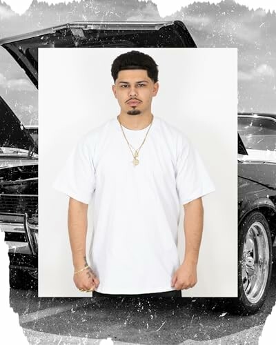 Man in white shirt standing in front of a car with its hood open.
