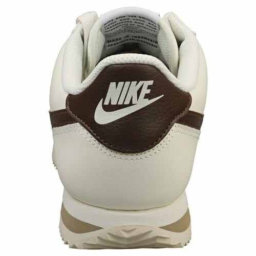Back view of a white and brown Nike shoe