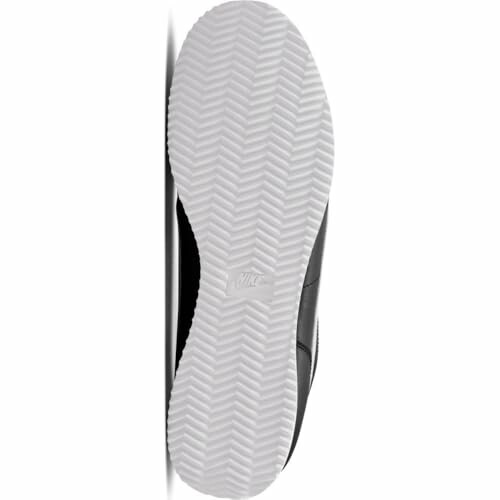 Bottom view of a Nike shoe showing the sole pattern.