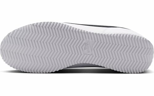 Bottom view of a Nike shoe sole with zigzag pattern.