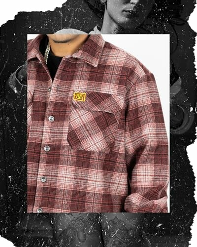 Person wearing a red plaid flannel shirt with a patch on the chest.