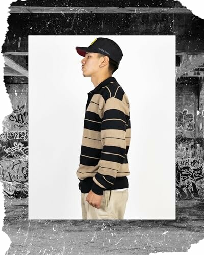Person in striped shirt and cap, side profile.